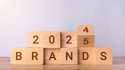 Planning 2025 brands new year symbol. Concept words 2024 Brands to 2025 Brands on wooden blocks. Business 2025 brands New Year concept