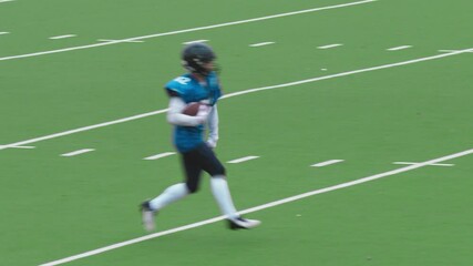 Footballer Catching the Ball and Sprinting to Score a Goal. Excited Team Celebrating Scored Points and Victory. Red and Blue American Football Teams Battle for the Championship Trophy