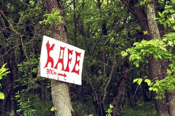Sign to the cafe in the forest