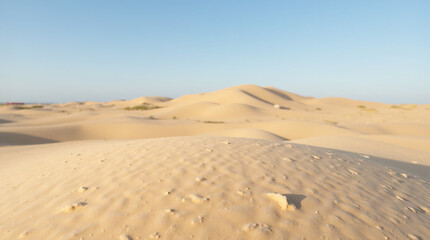 Blue sky, desert landscape, and sands