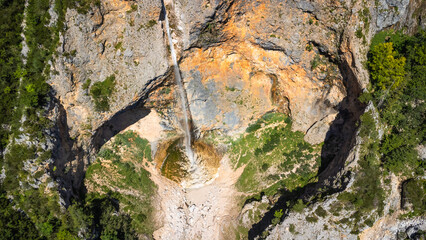Rinka waterfall plunging into logarska dolina valley in slovenia during summer © unai