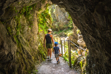 Mother and son exploring tolmin gorge in slovenia