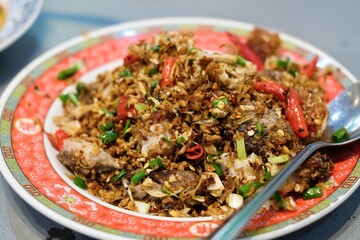 A plate of chilli and salt fried pork fried rice at Chula 50 Kitchen in Silom, Bang Rak - Bangkok Thailand