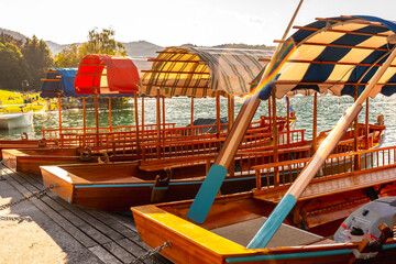 Traditional pletna boats docked at lake bled in slovenia