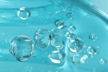 Abstract background of  water bubbles in shades of turquoise, conveying freshness  or cleanliness. Ideal for cosmetic, spa, or healthcare designs.