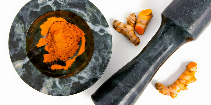 Ground Turmeric Powder on Mortar and Pestel – Spice for Culinary Use Natural Remedies, Food Blogs, Recipes, Spice Packaging, E-commerce, Cookbooks, Ads, Social Media, Health Websites