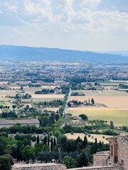 Scenic panoramic view over a picturesque Tuscan countryside landscape. Assisi, Italy.