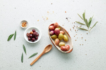 Ripe olives in a plate on a table 