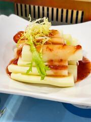 Freshly Prepared Vegetable Dish with Savory Sauce and Garnish