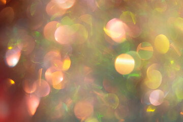 Abstract Christmas background multicolored bokeh. Unusual, sparkling, iridescent pearls with gold...