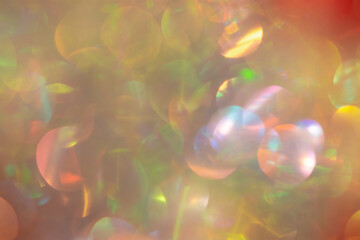 Abstract Christmas background multicolored bokeh. Unusual, sparkling, iridescent pearls with gold...