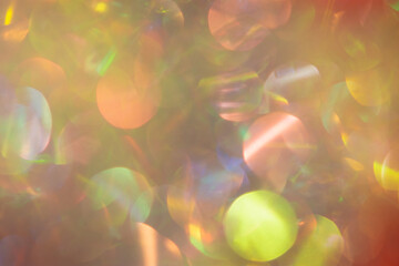 Abstract Christmas background multicolored bokeh. Unusual, sparkling, iridescent pearls with gold...