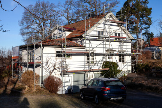 Car parked in front of building during renovation