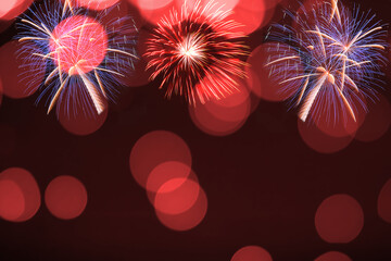 Colorful firework and blurred bokeh light with copy space in Christmas and New Year. Abstract background holiday concept.