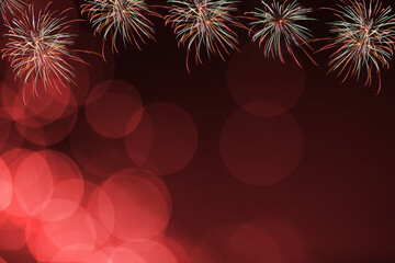 Red firework and blurred bokeh light with copy space in Christmas and New Year. Abstract background holiday concept.