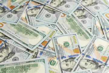 Banknotes of 100 American dollars top view, close-up.