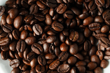 White cup with coffee beans