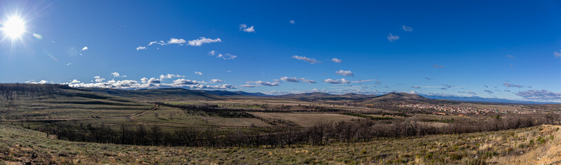 Panoramic view of the burnt mountain after a forest fire and the town of Ferreras de Abajo from the Mirador de La Pedrizona area, Sierra de la Culebra, Zamora, Castilla y León, Spain.