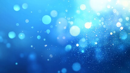 Obraz premium Beautiful abstract blue bokeh background with sparkling light effects.