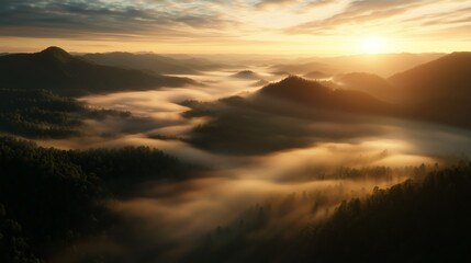 Fototapeta premium Serene sunset over misty mountains captures the beauty of nature at dawn in tranquil wilderness landscape