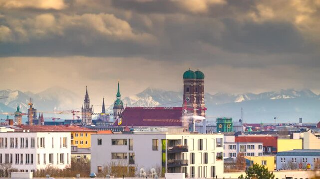 Munich skyline panorama time lapse view of munich fraunekirche church cathedral downtow panorama view alps mountains marienplatz.