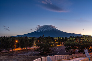 View of Mount Fuji during sunset with moving cloud on top of the mountain