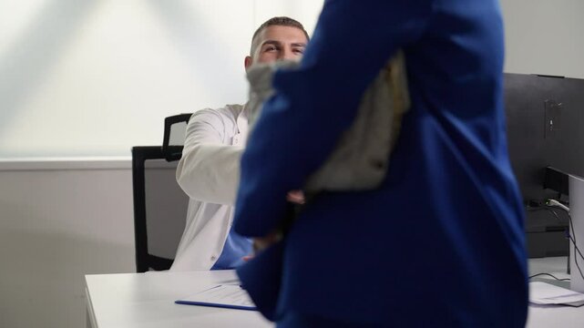 Smiling doctor bids farewell to a patient in a bright medical office, conveying warmth and professionalism. Concept of patient-doctor relationship and healthcare services.