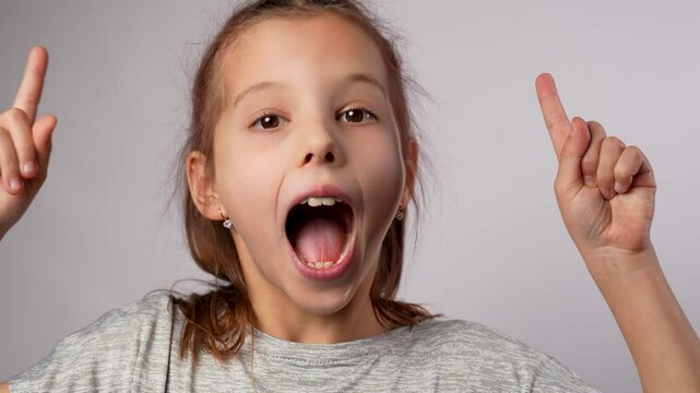 Child have a big idea. Cute girl thinking surprised and amazed face expression