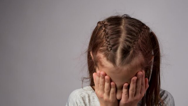 Disappointed child slapping forehead with hand making mistake, forget bad memory