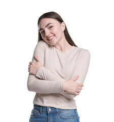 Charming young woman hugging herself on white background