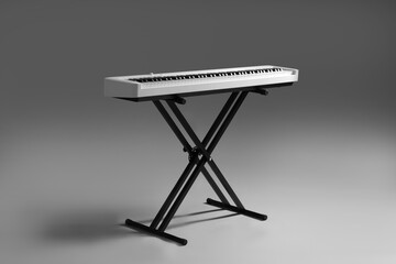 Synthesizer on grey background. Electronic musical instrument