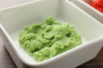 Hot wasabi paste on wooden table, closeup