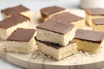 Delicious puffed rice bars on table, closeup