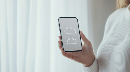 Cloud Storage Access on Mobile: A woman's hand gently holds a smartphone displaying cloud storage icons, symbolizing seamless access to data anytime, anywhere.