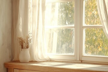 Soft sunlight filters through a window illuminating dried flowers in a cozy indoor setting