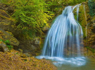 Obraz premium high waterfall on mountain river