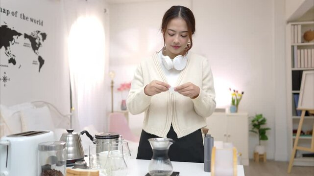 Asian young woman enjoying bread and coffee for breakfast at home, morning routine before work