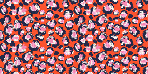 Colorful leopard-inspired pattern with abstract spots in  pink shades on a orange background. Bold, modern design animal print perfect for fashion, textiles,  creative branding projects.
