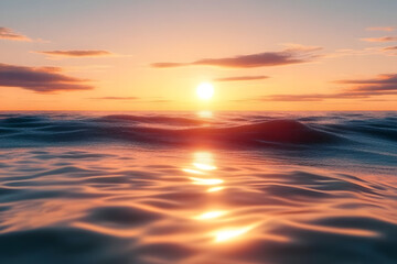Obraz premium A serene sunset over the ocean, reflecting warm colors on the water.