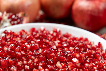 Ripe red pomegranate seeds close-up