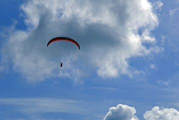 Beautiful paragliding flight in the clouds.