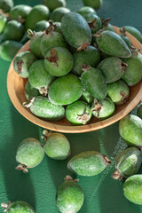 Feijoa green fruit bowl. Diet food. Guava harvest. Vegetarian plate