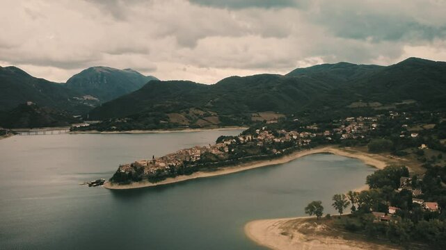 Drone shot across the beautiful villa of Colle di Tora in the middle of Turano lake