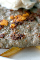 close up of a slice of meatball