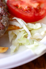 Baslama, meatball salad and onion, Close up.