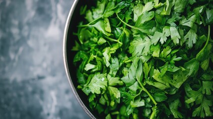 Freshly chopped parsley in a stainless steel bowl showcasing vibrant green color perfect for garnishing and enhancing dishes.