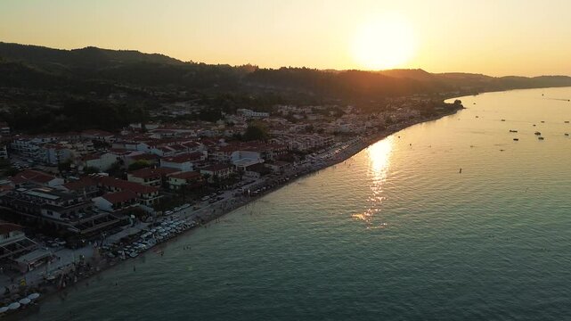 Drone footage panorama of Pefkochori beautiful tourist city by the sea on Kassandra peninsula, Halkidiki, Greece