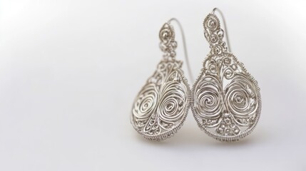Vintage Handmade Sterling Silver Filigree Earrings with Intricate Swirl Designs Isolated on White Background