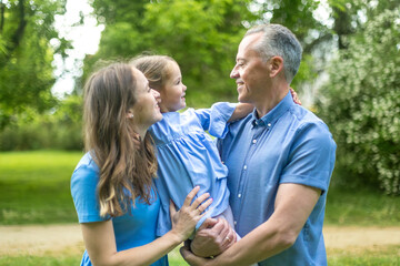 Happy family enjoying time together in green park