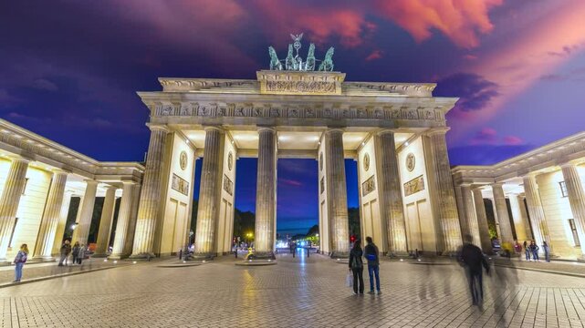 Berlin Brandenburg Gate night Germany time lapse hyperlapse footage in 4K. Berlin skyline street at night. Berlin skyline at night.